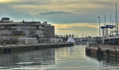 Fototapeta premium Boats in a small Italian port on a morning after the rain
