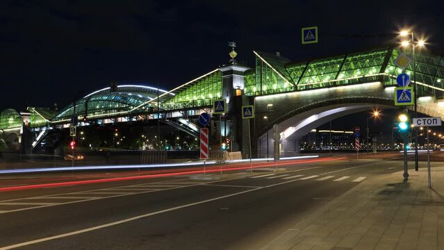 Night city landscape with a view of pedestrian Bogdan Khmelnitsky Bridge over the Moscow River, Russia
