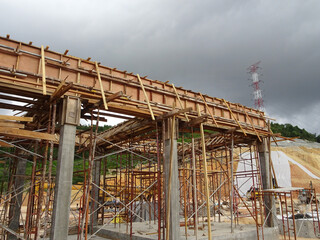 KUALA LUMPUR, MALAYSIA - JULY 7, 2021: Beam and column formwork installed at a construction site. Molds are made of wood and plywood. Be the basis of form to reinforced concrete.