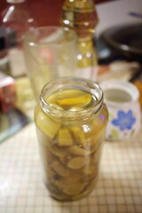 Fototapeta na wymiar jar of pickled mushrooms on the table