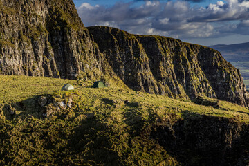 Hiking and Wild Camping, Binevenagh Mountain, Causeway coast and glens, area of oustanding natural beauty, County Londonderry, Northern Ireland