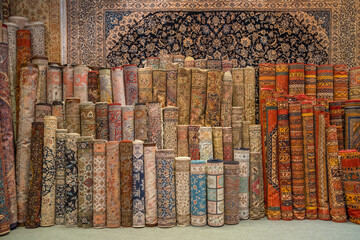 Variety of the gorgeous oriental carpets in traditional carpet store in Middle East