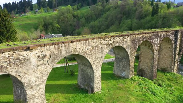 stone arched railway bridge over the Prut River in the Carpathians in the village of Vorokhta. One of the oldest and longest stone arched bridges (viaducts) in Europe: length 200 meters;