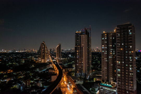aerial view of Towers business area on night Business District Low Light, Over Urban Junction concept or abstract of advanced innovation, financial technology, energy power