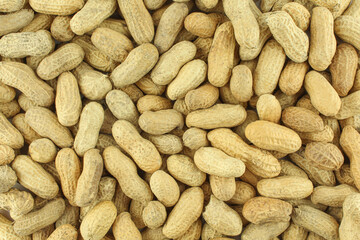 Peanuts in shell textured background