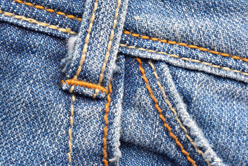Macro of belt loop jeans pants, Denim texture pattern, Close up of stitch and fabric detail background.