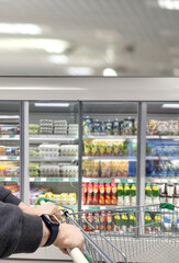 man choosing a dairy products at supermarket.