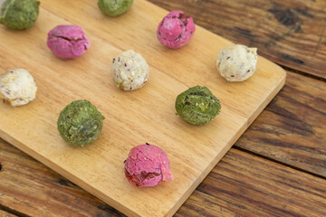 Brazilian vegan cheese bread - Multicolored gluten free rolls made of tapioca flour, potato, spinach and beetroot.