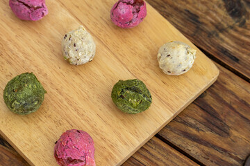 Brazilian vegan cheese bread - Multicolored gluten free rolls made of tapioca flour, potato, spinach and beetroot.