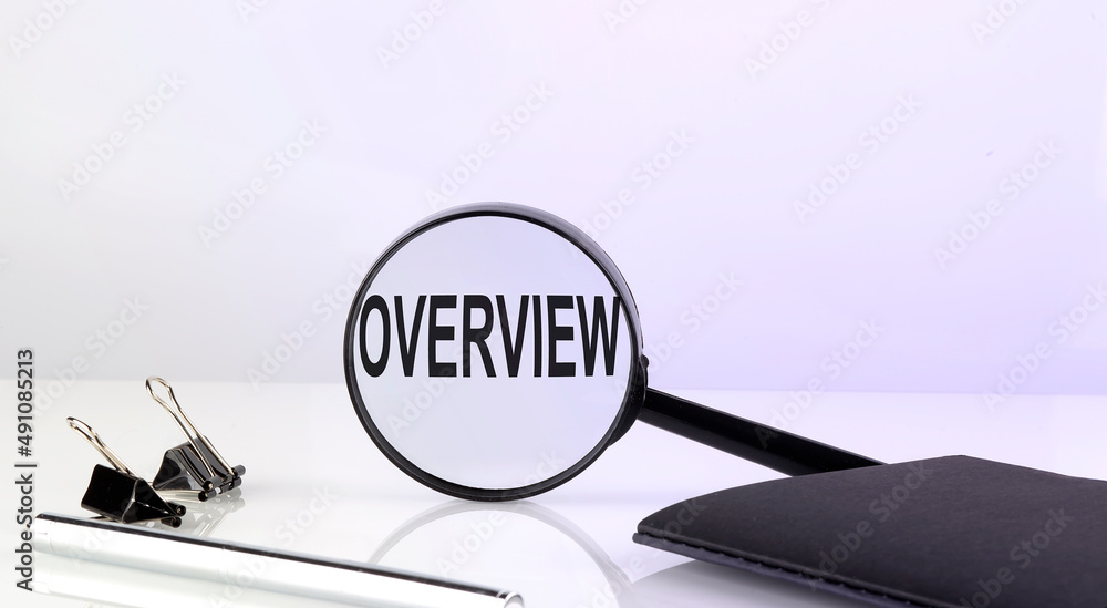 Poster overview text concept. magnifier glass with text with notebook and pen,business