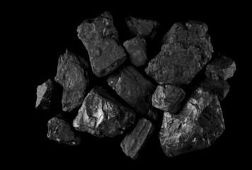 Pile black coal isolated on black, clipping path and top view