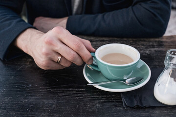 Married man drinking coffee
