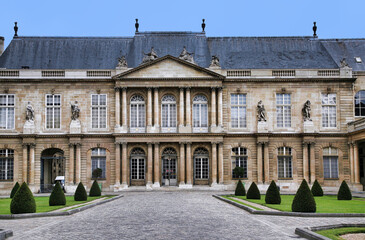 Paris, France:  The ornate baroque facade of the French National Archives museum in the Marais district, housed in the 18th century Soubise palace