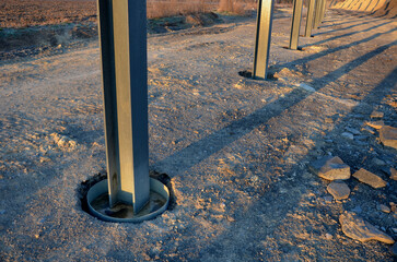 installation of traffic noise barrier begins with concreting of columns made of steel cross-beams ...