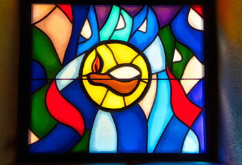 Decorative stained glass with motives from Christian religion used on windows in catholic church in Sarajevo, Bosnia and Herzegovina.