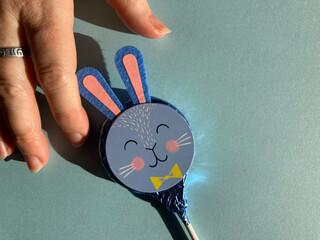 Hand with Easter bunny lollipop