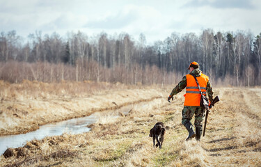 Pheasant hunting, hunter with dog