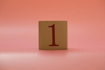 Numbers or dates on wooden cubes, one