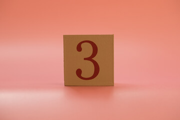 Numbers or dates on wooden cubes, three