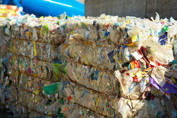 Bales of plastic waste on a plastic recycling plant