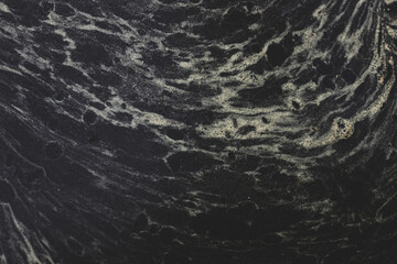 Pollen in a puddle. Beautiful stains in the water. Brownian motion of particles in a liquid. Spring pollen is yellow	