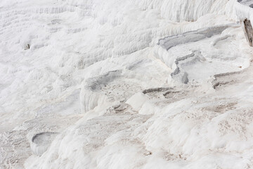 White dried-up travertine terraces without water. Pamukkale, Turkey.