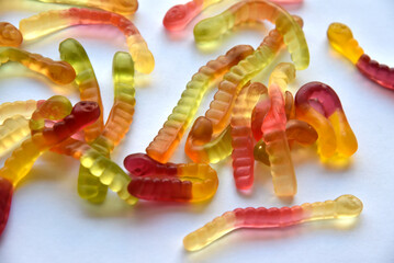 Colorful delicious marmalade worms on a plate