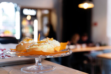 Morning in cafe and fresh sweet breakfast. Homemade delicious cinnamon bun with crumble. Baked goods as a snack. Close up.