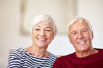 Devoted to each other. Portrait of a loving senior couple at home.