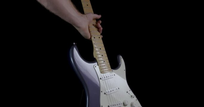 Hand Lifting Electric Guitar Dramatic Tilt Up Wide