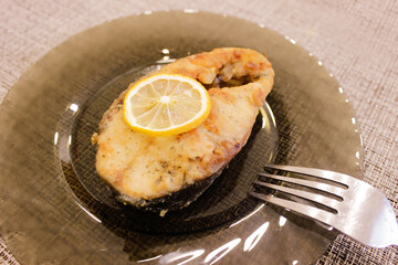 Grilled fish on plate isolated on white background. Cutout and mockup for restaurant menu, top view