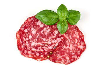 Italian Salami with basil leaves, isolated on white background.