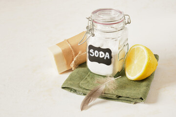 soda jar, lemon, soap and bird feather