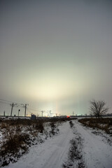 Obraz premium road to city forest in the night . Night landscape. Nightsky and clouds . Stars in the sky . Lights of the city . 