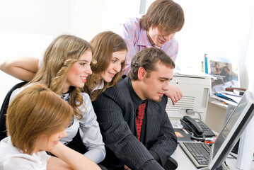 Group of businesspeople working with pc in office