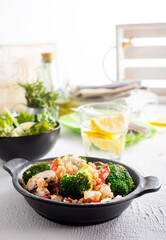 vegetarian stir fry in black pan, vegan food