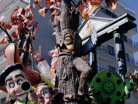 PUTIGNANO, ITALY - FEBRUARY 3, 2013: paper mache creatures (a living tree, an old man) from the traditional Carnival float parade. This is one of the oldest and longest (dated from 1394) carnival.