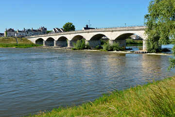 Fototapeta na wymiar River Loire and bridge of Général Leclerc at Amboise, a commune renowned for its magnificent castle, in the Indre-et-Loire department in central France. 