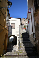 Fototapeta na wymiar A narrow street among the old stone houses of Sarno, town in Naples province, Italy.
