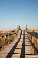 Boardwalk to the beach with blue skies