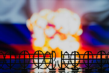 Barbed wire on the background of the Russian flag. Conceptual photo of sanctions