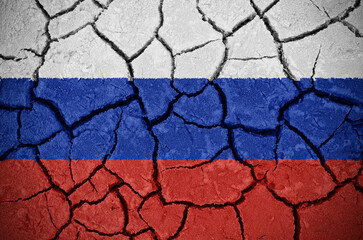 Cracks in the texture wall with the flag of Russia