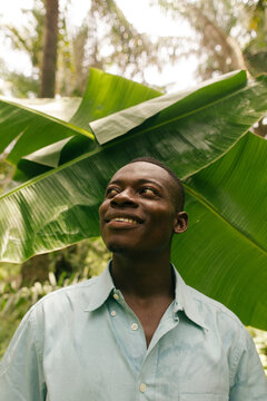 Smiling portrait of a black african male farmer in the rainforest