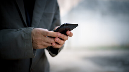 Man using smart phone.