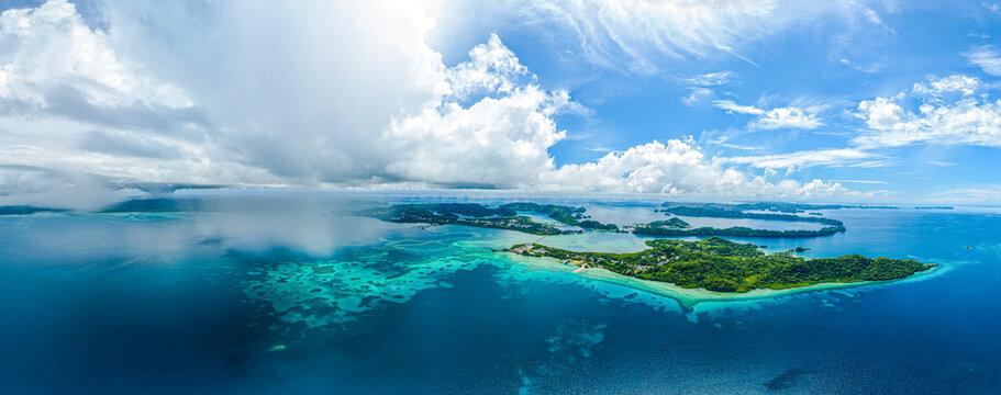 Aerial panorama of tropical islands clouds and rain showers
