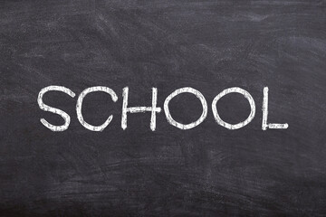 School sign handwritten on chalkboard