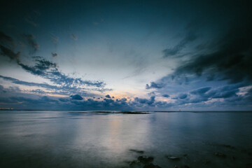 Fototapeta na wymiar Blue ocean landscape right after sunset on tropical island
