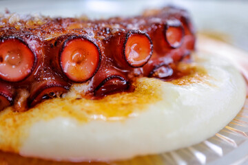 Grilled octopus on potato foam and paprika oil © Cavan