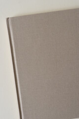 close up of a book (with warm gray cloth cover)