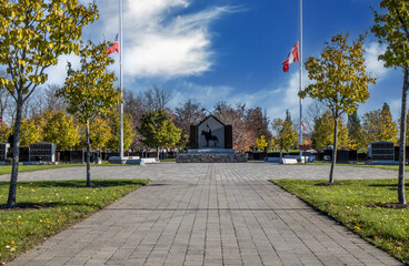 The Royal Canadian Mounted Police memorial to fallen officers, flags at half mast, paving stone...